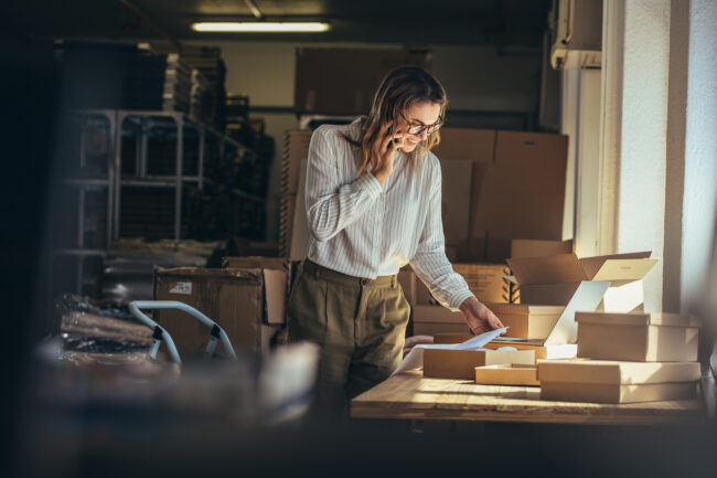 Woman,Online,Seller,Confirming,Orders,From,Customer,On,The,Phone.